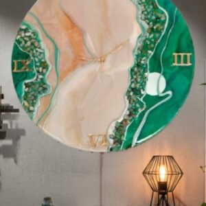 A luxury green geode resin clock mounted on a minimalist concrete wall, styled above a dark wood shelf