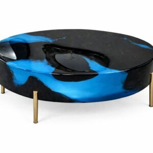 Black and blue epoxy resin round center table with gold metal legs placed in modern industrial living room in Mumbai